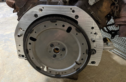 Transmission adapter installed on an egine